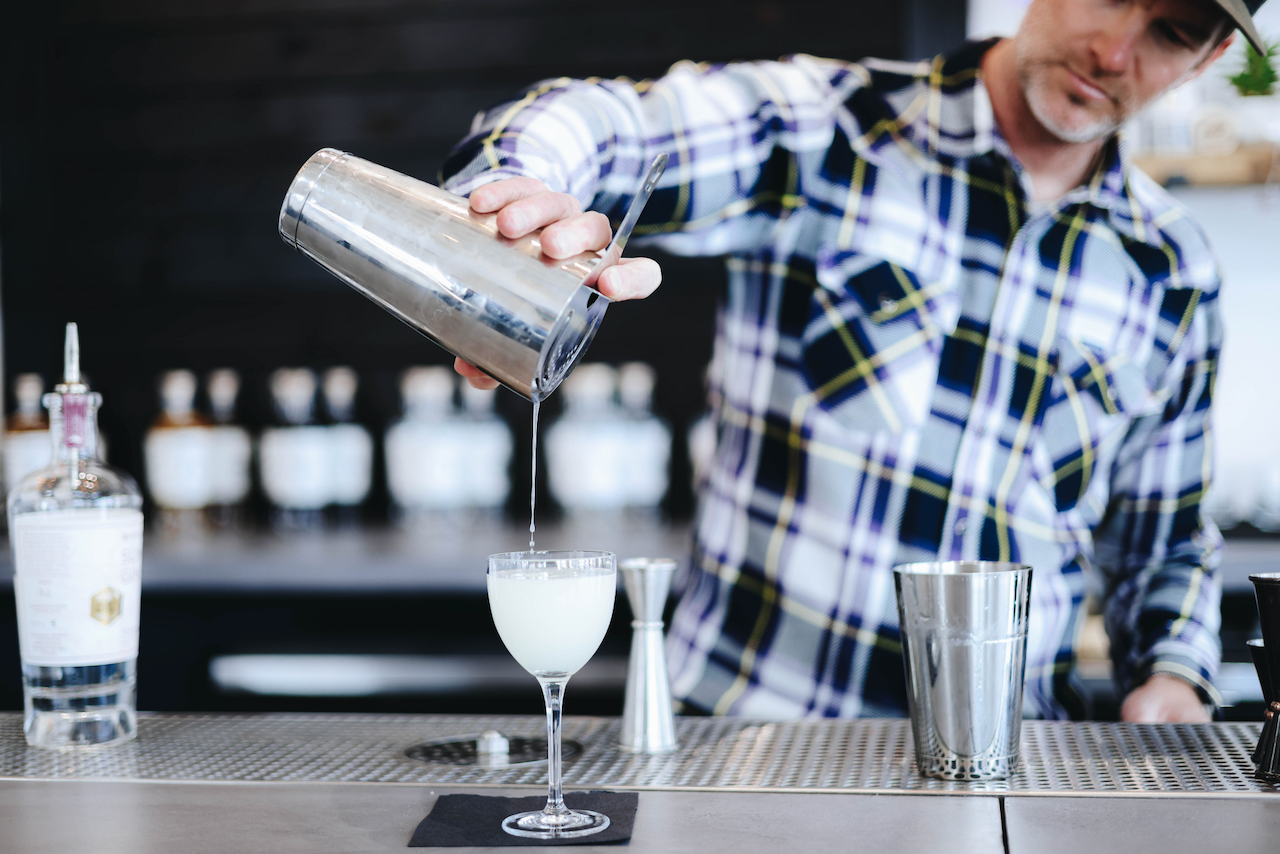 Pouring a cocktail at Routt Distillery